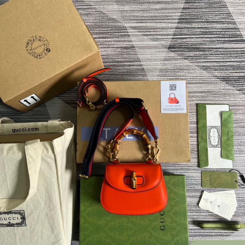 G*u*i top handle bags